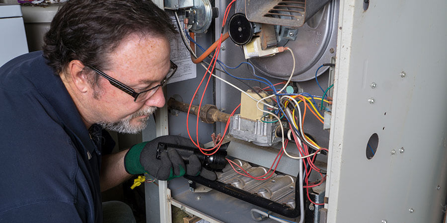 technician installing a furnace